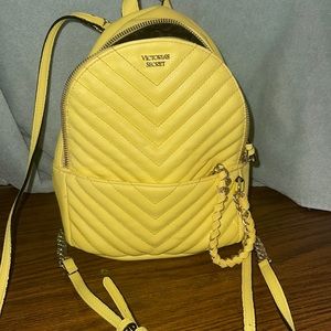Victoria Secrets Mini “neon yellow”  chain back pack .